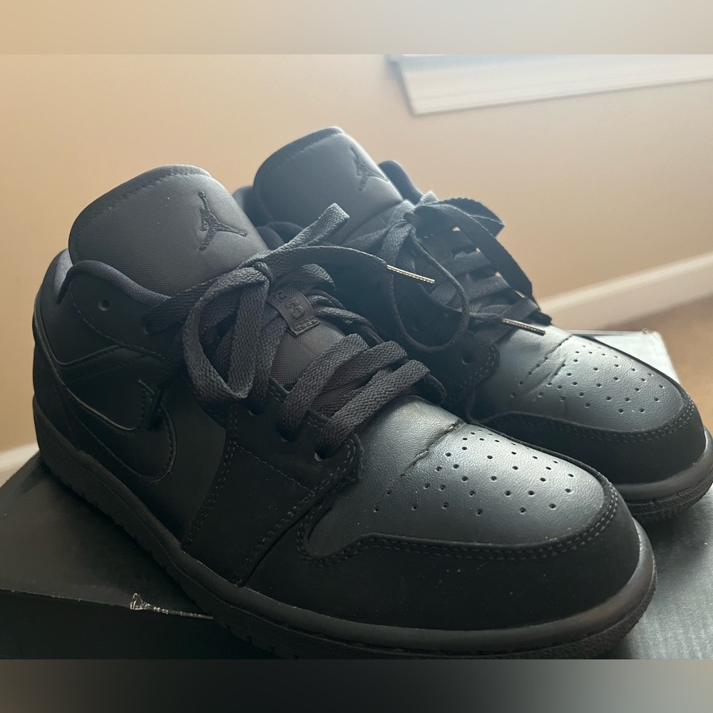 Up for sale is a pair of Air Jordan 1 Low Black/Black Noir Size 9